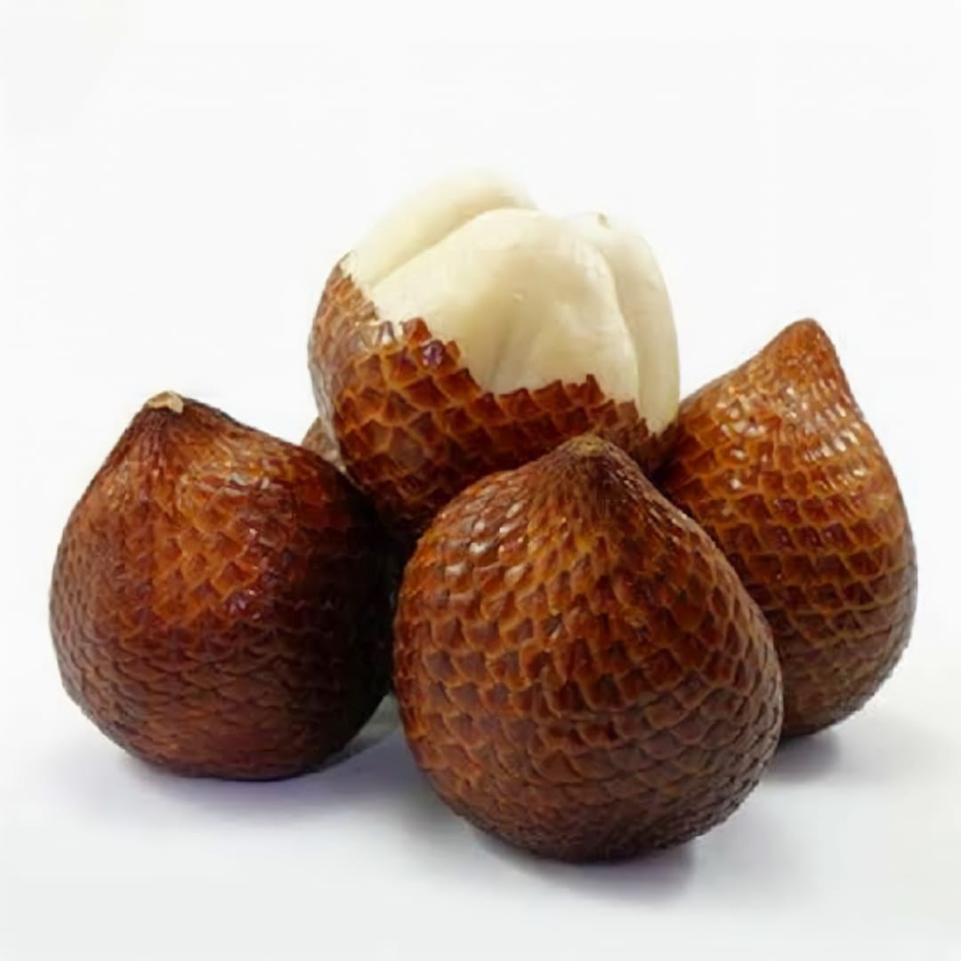 Cluster of Pondoh snake fruit with distinctive scaly reddish-brown skin and segmented appearance, displaying the exotic tropical fruit from Indonesia